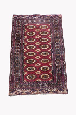 Lot 491 - A Pakistan rug, the madderfield with eight...