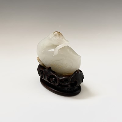 Lot 15 - A fine Chinese white jade carving of a duck,...