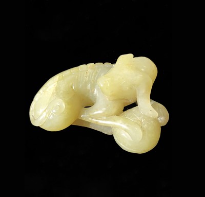 Lot 23 - A Chinese jade carving of a recumbent hound,...