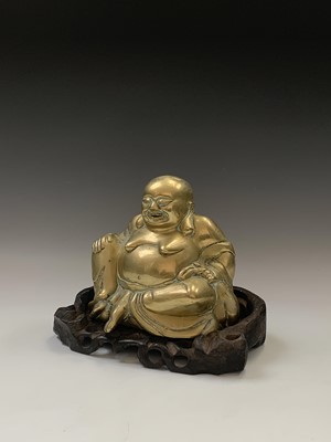 Lot 144 - A Chinese brass model of a seated buddha,...