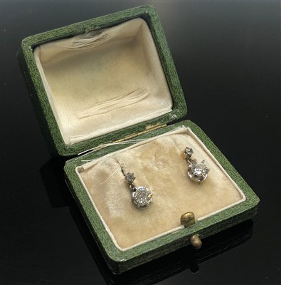 Lot 2568 - A pair of diamond earrings, each has a...