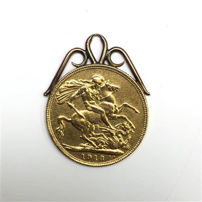 Lot 2491 - A 1913 sovereign with scrolling gold soldered...