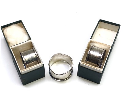 Lot 2008 - A pair of engine turned silver napkin rings...