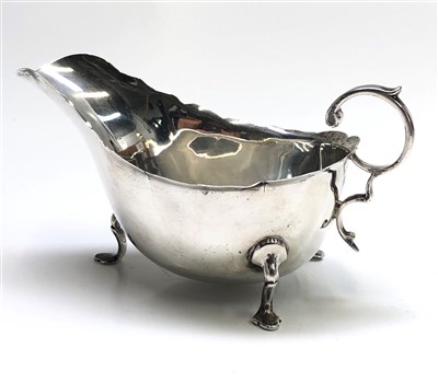 Lot 2010 - An Edwardian silver sauce boat with scalloped...