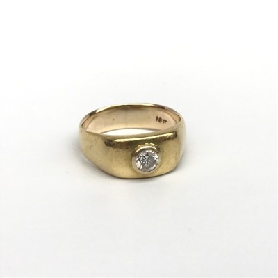 Lot 2438 - An 18ct gold ring collet set a diamond, 9g.