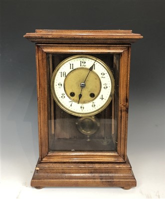 Lot 3009 - A decorative mantle clock with a cream enamel...