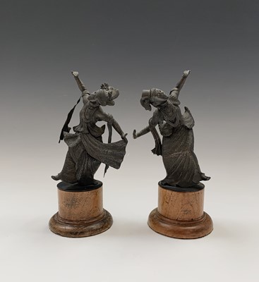 Lot 180 - A pair of Tibetan bronze figures of dancers,...