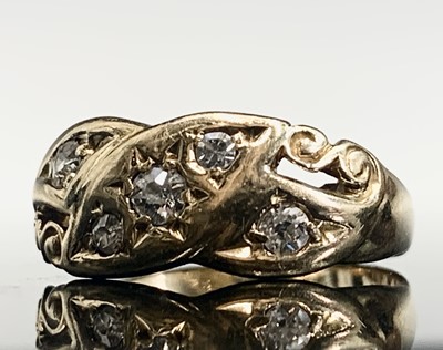 Lot 396 - An 18ct gold ring set with diamonds in...