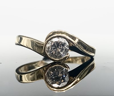 Lot 571 - An 18ct gold diamond solitaire contemporary...