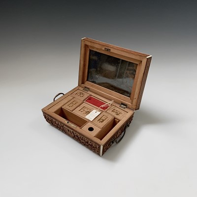 Lot 386 - An Anglo-Indian carved sandalwood work box,...