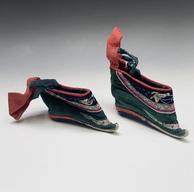 Lot 249 - A pair of Chinese silk embroidered lotus shoes,...