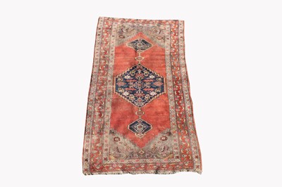 Lot 499B - A Kurdish rug, the madder field with an indigo...