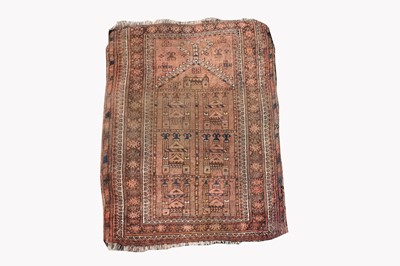 Lot 499C - An Afghan prayer rug, the camel field with a...