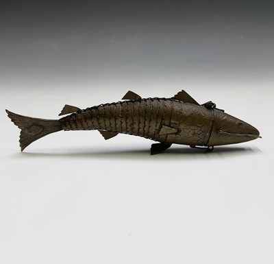 Lot 242 - A Chinese brass articulated fish, circa 1900,...