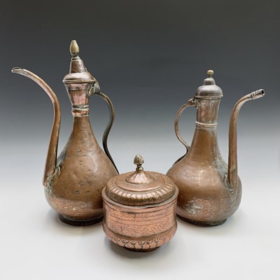 Lot 393 - Two Islamic copper ewers, 19th century,...