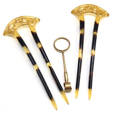 Lot 2539 - A gold taper holder, 4.6g and a pair of...