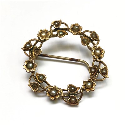 Lot 2540 - An Arts and Crafts gold circle brooch set with...