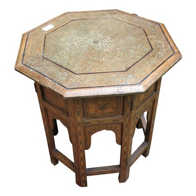 Lot 3406 - An Islamic brass inlaid folding octagonal...