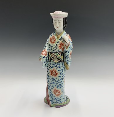 Lot 345 - A Japanese porcelain figure of a Geisha girl,...