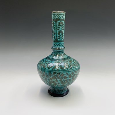 Lot 428 - A Persian pottery bottle vase, the turquoise...