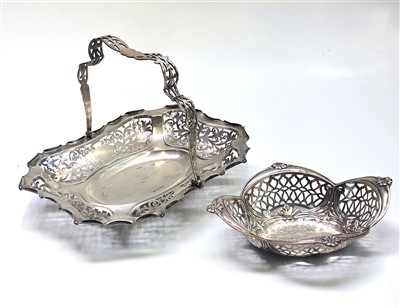 Lot 2019 - A pierced silver basket with swing handle...