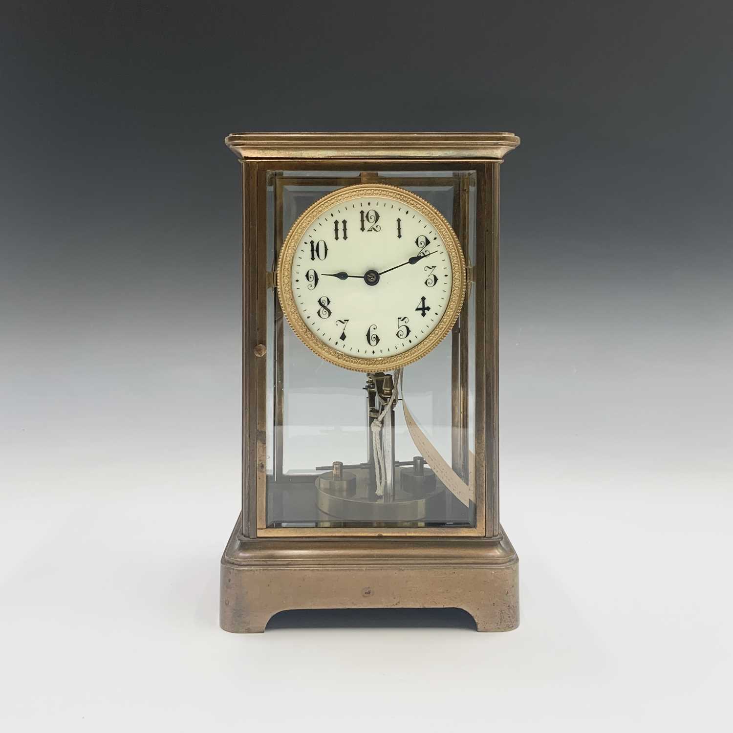 Lot 2936 - A German 400 day brass four glass torsion...