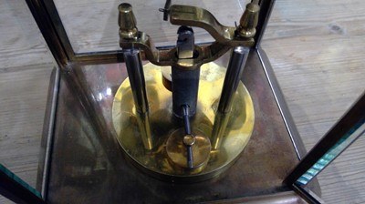Lot 2936 - A German 400 day brass four glass torsion...