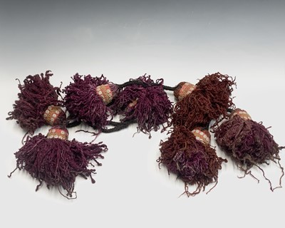 Lot 498D - An Afghan camel woollen bridle decoration.