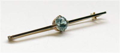 Lot 2778 - A 9ct yellow gold bar brooch faced with 18ct...