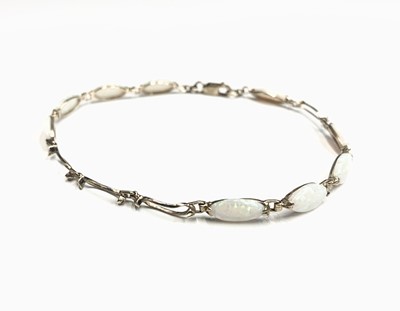 Lot 715 - A gold and opal bracelet ( stones missing)