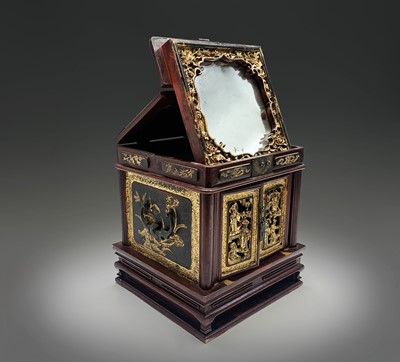 Lot 7 - A Chinese hardwood and giltwood carved table...