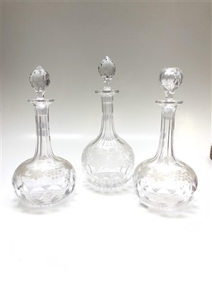 Lot 993 - Three cut glass decanters with fruiting vine...