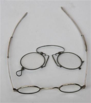 Lot 2427 - A pair of George lV silver reading glasses...