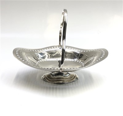 Lot 2060 - A footed silver quatrefoil swing handle basket...