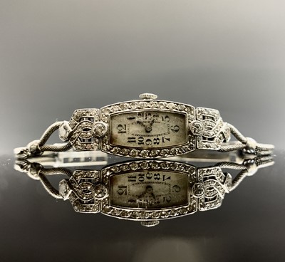 Lot 808 - A white gold ladies art deco diamond set...