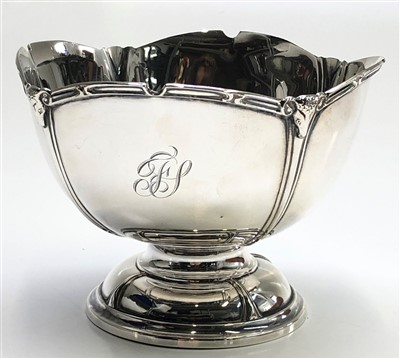 Lot 2103 - A footed silver bowl with waved rim, the dips...