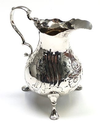 Lot 2113 - A silver cream jug in Georgian style with...