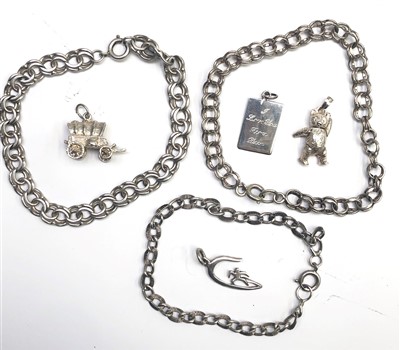 Lot 2604 - Silver charms and bracelets, 36.7g.