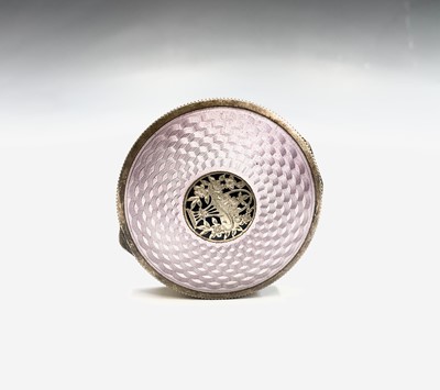 Lot 201 - An enamelled gilt compact