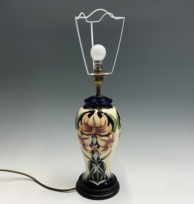 Lot 819 - A Moorcroft 'Sweet Lily' pattern table lamp....
