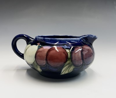 Lot 832 - A Moorcroft 'Wisteria' pattern jug, having...