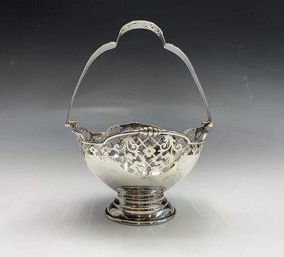 Lot 31 - A pierced bonbon basket with bail handle by...