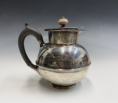 Lot 105 - A Liberty silver hot water jug with globular...