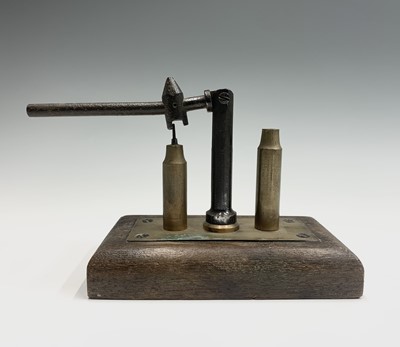 Lot 29 - A 20th century brass and steel bullet packer...