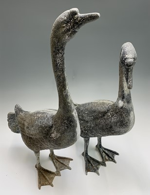 Lot 637 - A pair of metal geese garden ornaments. The...