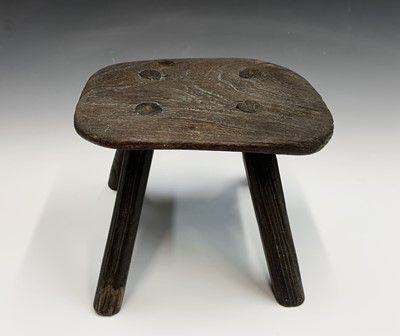 Lot 76 - A 19th century elm small stool or candle stand,...