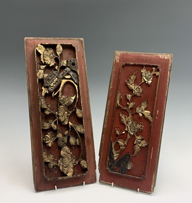 Lot 186 - Two Chinese red painted carved wood panels,...