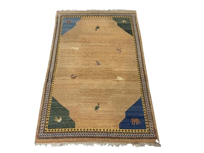 Lot 1212 - A Gabbeh carpet, the camel field with animals...