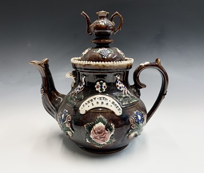 Lot 827 - A Victorian Measham treacle glazed bargeware...