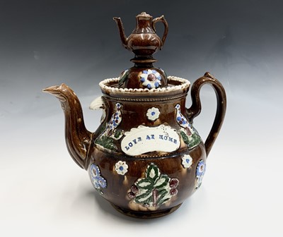 Lot 830 - A Victorian Measham treacle glazed bargeware...